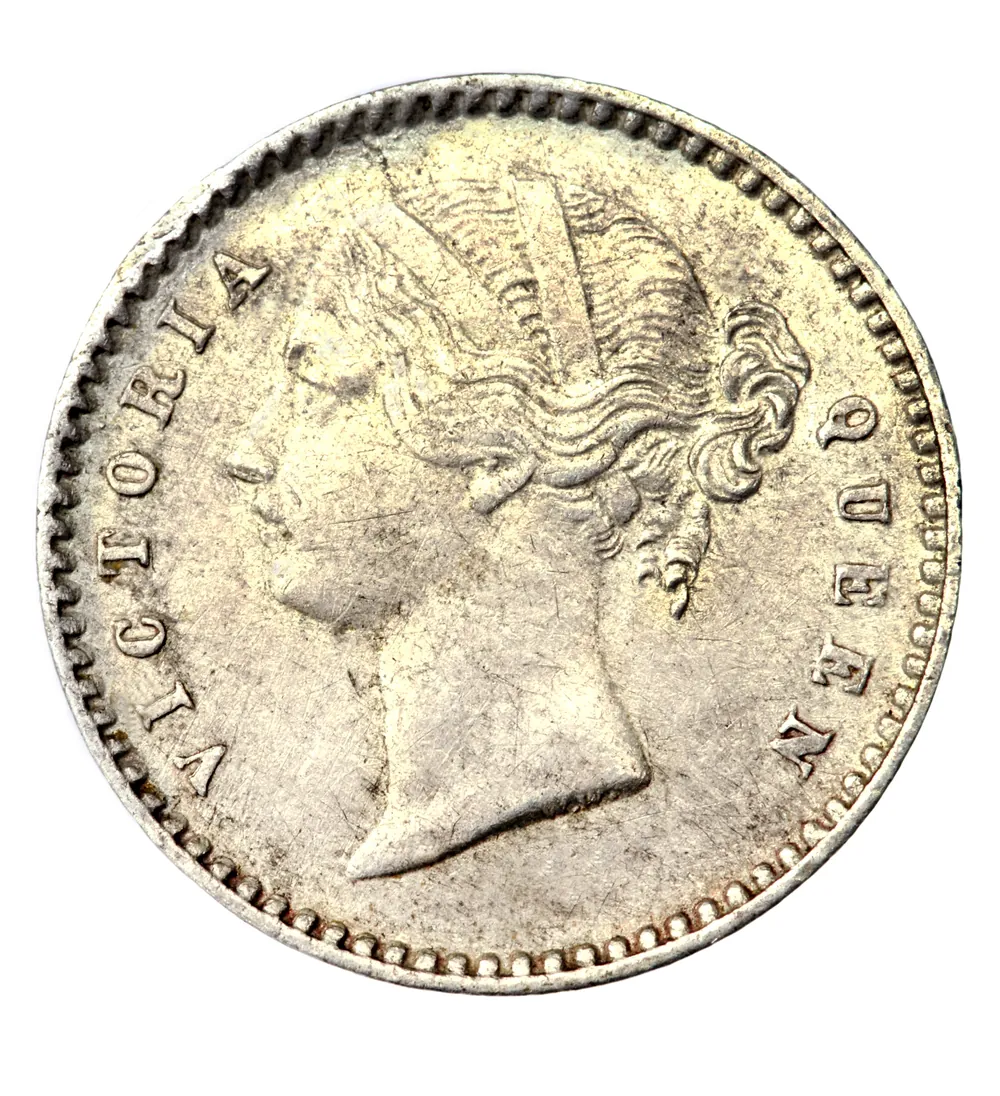 Close-up of a worn silver coin, illustrating the detail collectors look for